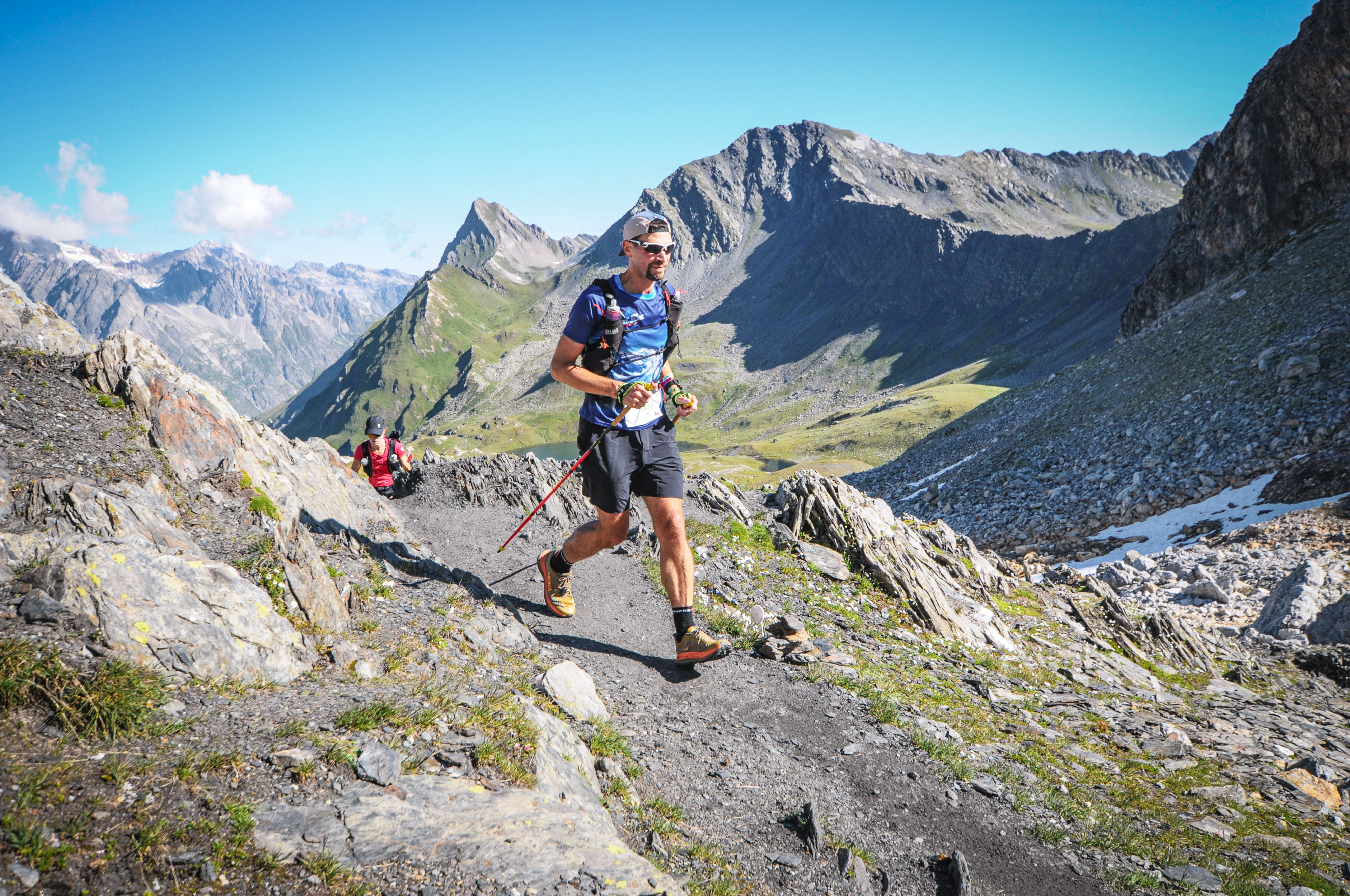 Ultra trail runner above the clouds at sunrise