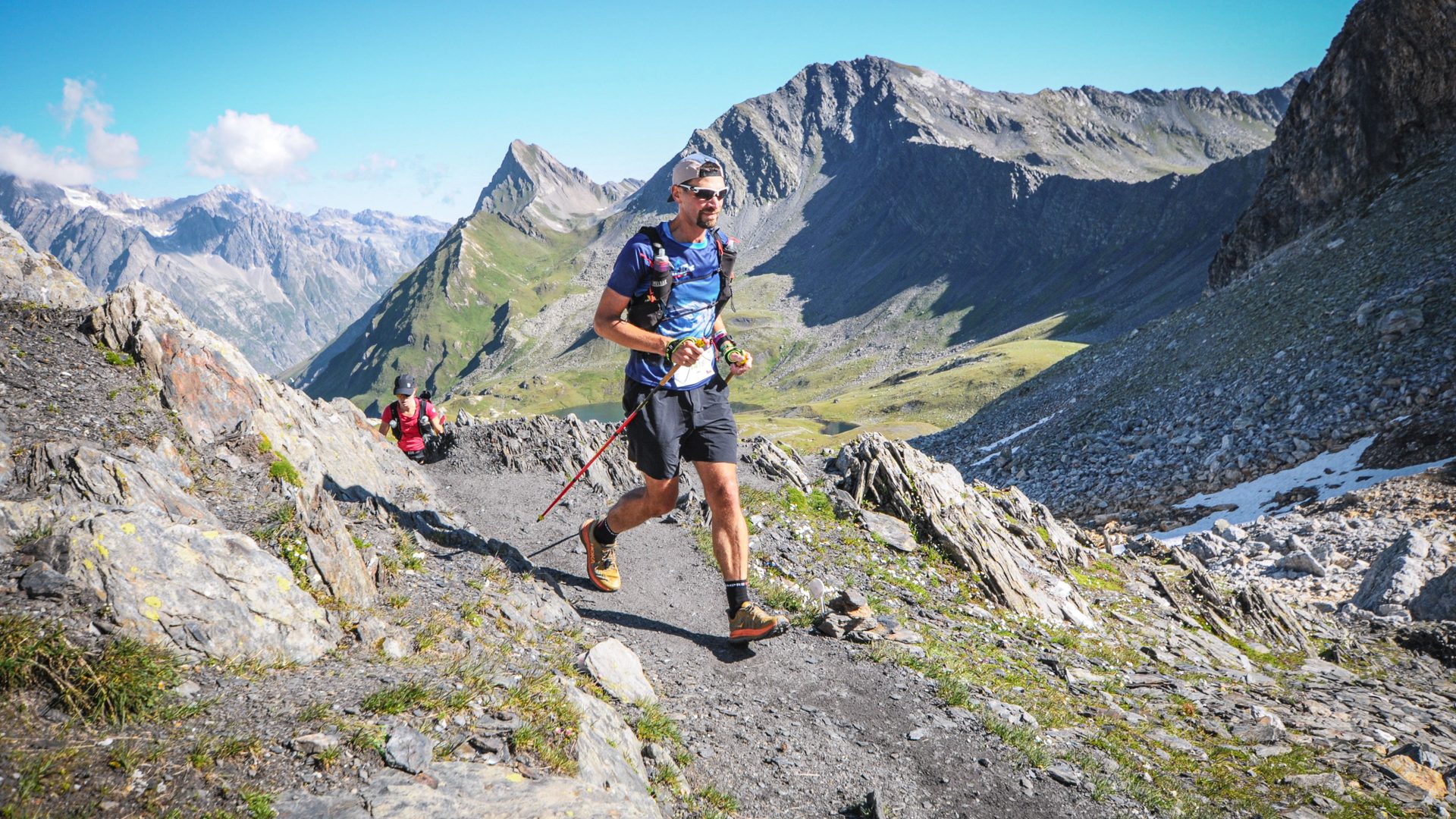 Ultra trail runner above the clouds at sunrise
